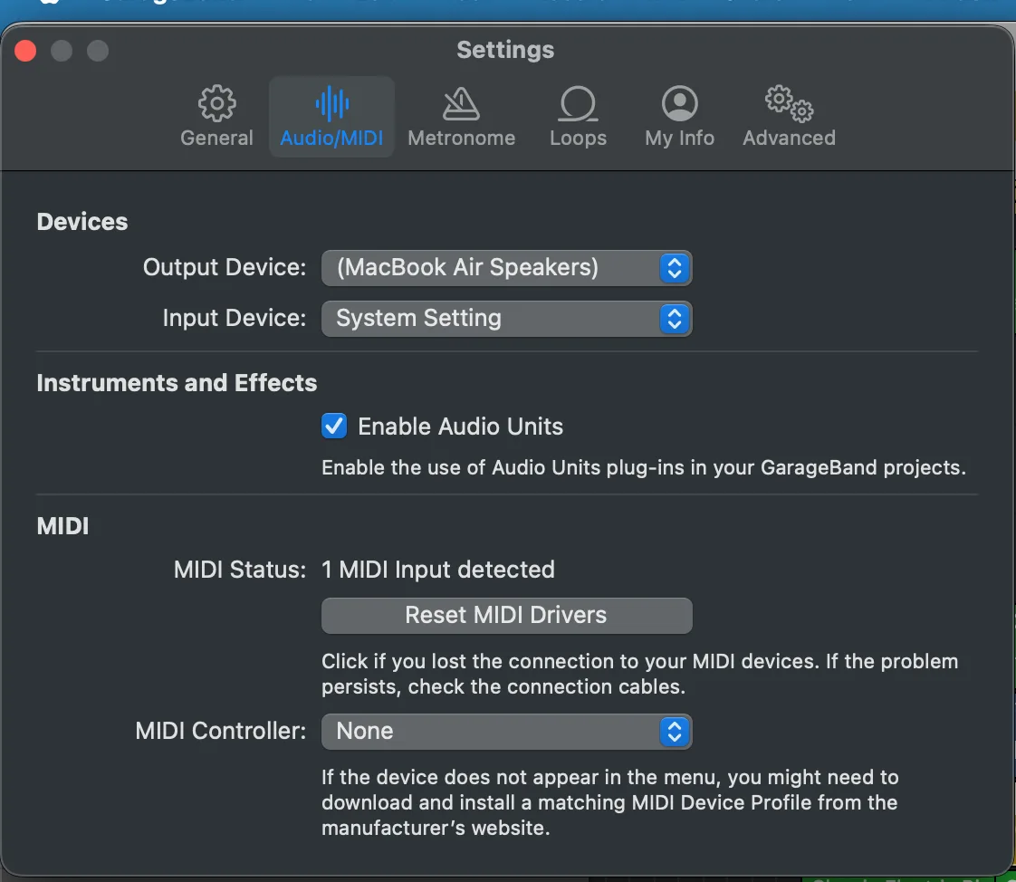 The GarageBand Settings window on the Audio/MIDI tab, showing output and input device pickers, an Enable Audio Units checkbox, and MIDI status